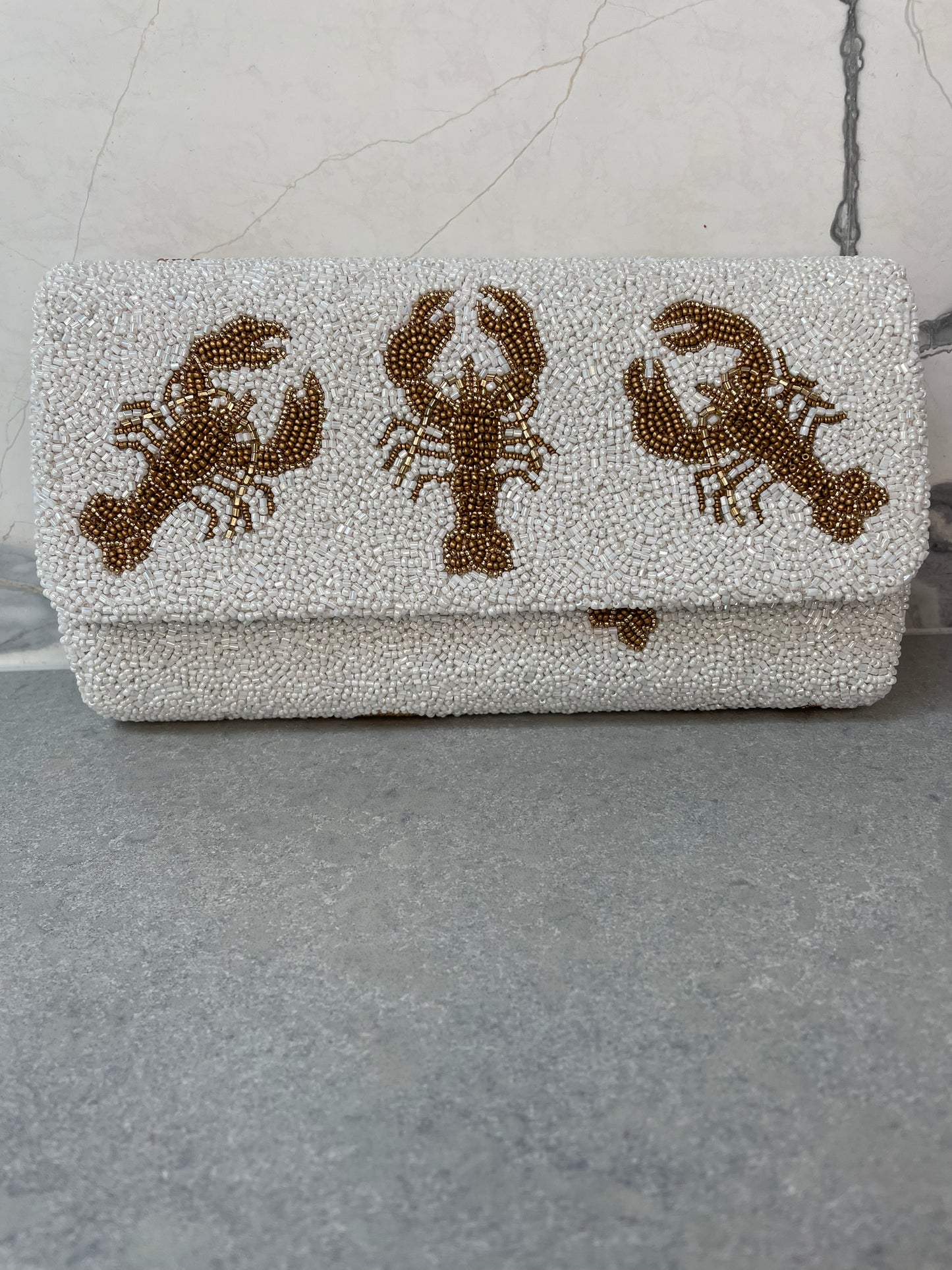 LOBSTER CLUTCH WHITE AND GOLD